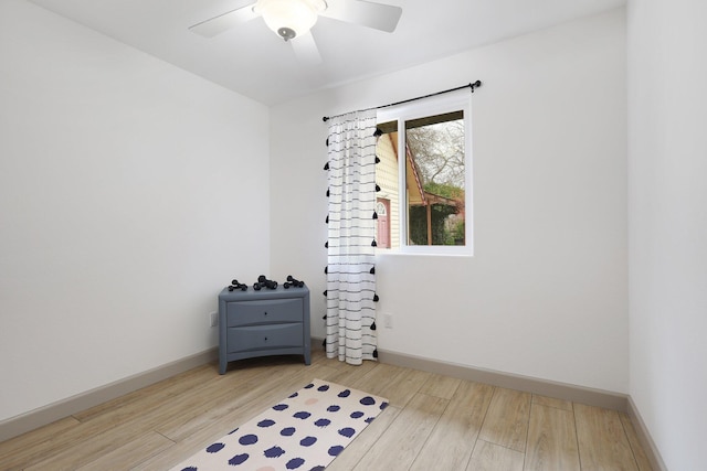 interior space with ceiling fan and hardwood / wood-style flooring