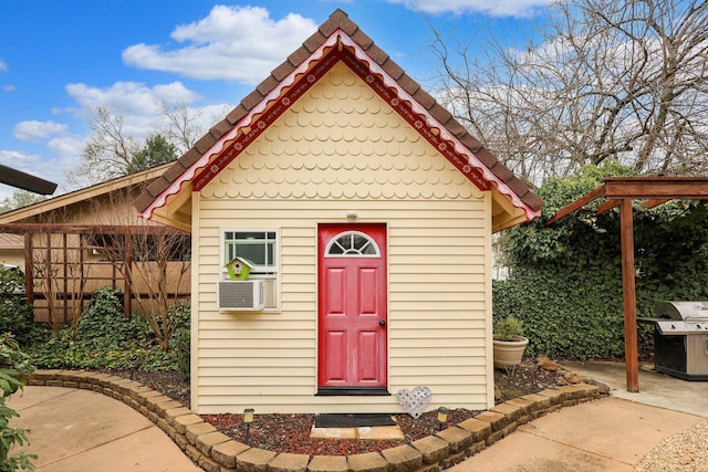 view of outbuilding with cooling unit