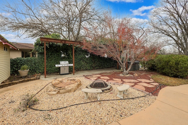 view of patio / terrace featuring a fire pit and grilling area