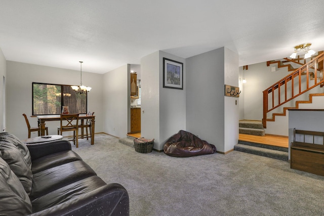 carpeted living room with a chandelier and a textured ceiling