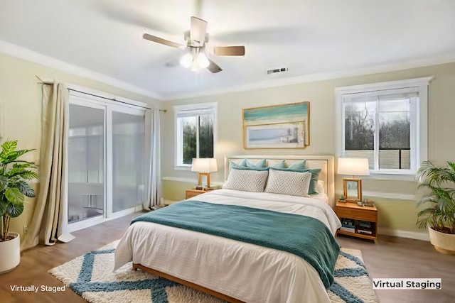 bedroom featuring ceiling fan and crown molding