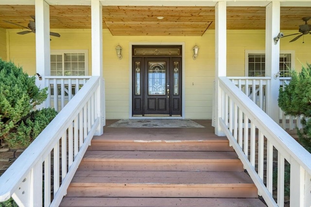 view of exterior entry with ceiling fan