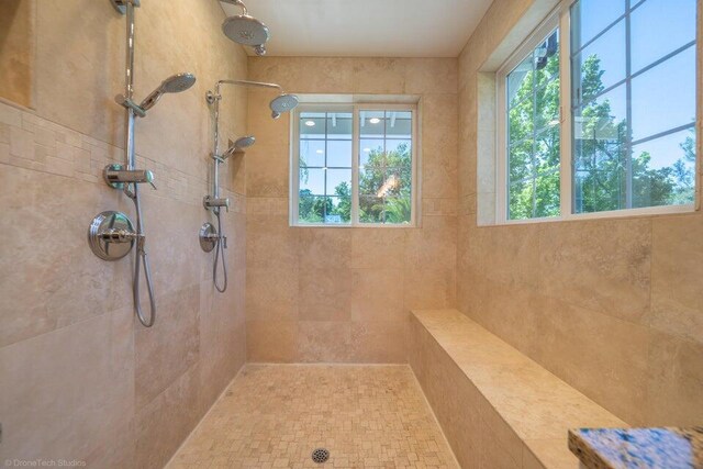 bathroom with a tile shower