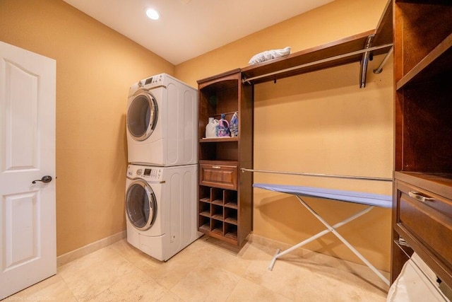 laundry room featuring stacked washer and dryer