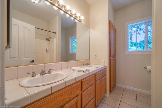 bathroom with tile patterned floors and vanity