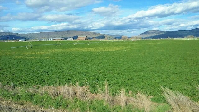 view of mountain feature with a rural view