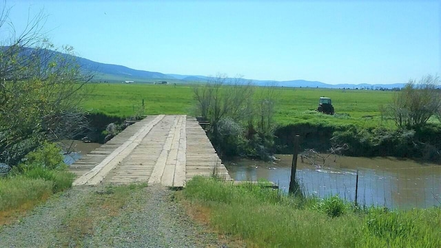 exterior space featuring a water and mountain view