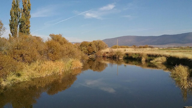 property view of water featuring a mountain view