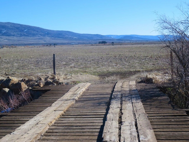 property view of mountains featuring a rural view