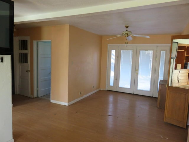 interior space with french doors, light hardwood / wood-style floors, and ceiling fan