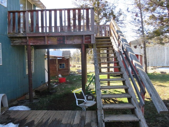 exterior space with a wooden deck and a shed