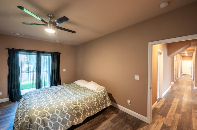 bedroom with hardwood / wood-style floors and ceiling fan