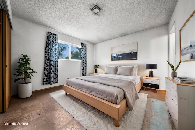 bedroom with a textured ceiling