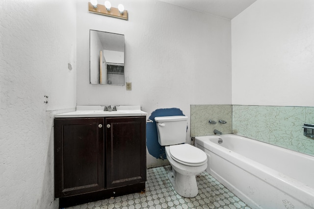 bathroom featuring vanity, toilet, and a bathtub