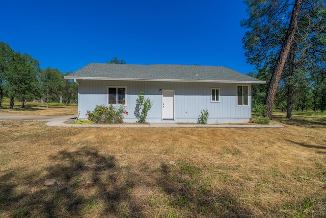 rear view of house with a yard