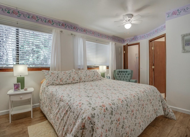 bedroom featuring ceiling fan and light hardwood / wood-style floors