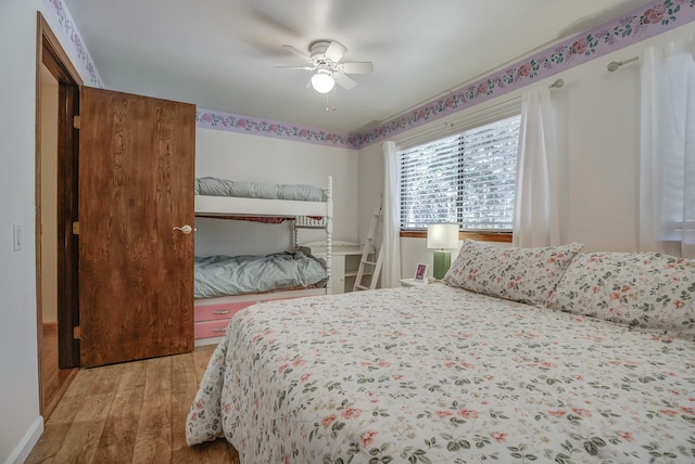 bedroom featuring ceiling fan and light wood-type flooring