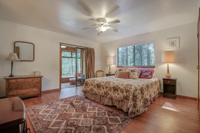 bedroom featuring hardwood / wood-style floors and ceiling fan