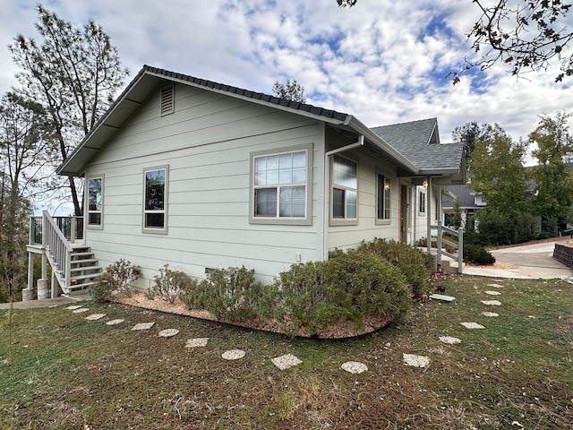 view of home's exterior featuring a yard