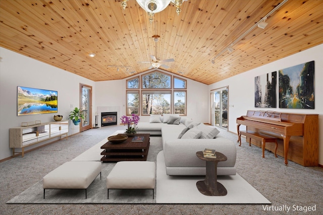 carpeted living room featuring vaulted ceiling, ceiling fan, and wood ceiling