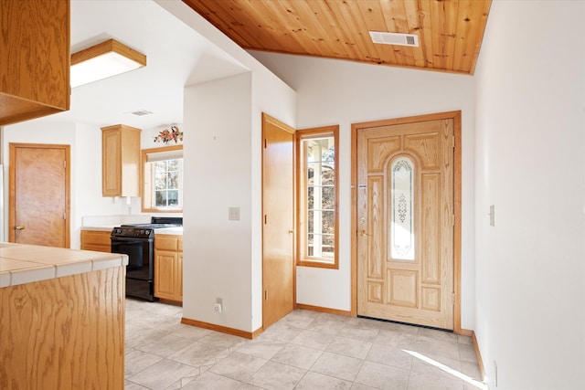 tiled entrance foyer with lofted ceiling and wood ceiling