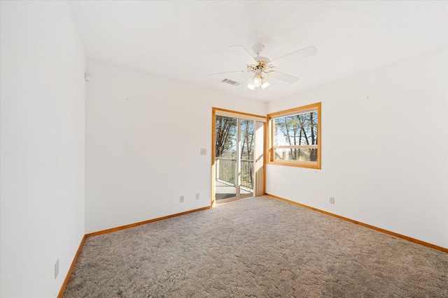 carpeted empty room with ceiling fan