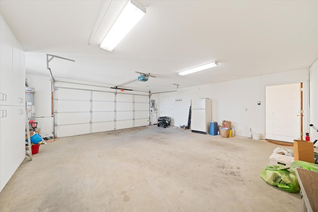 garage featuring a garage door opener, gas water heater, and white refrigerator