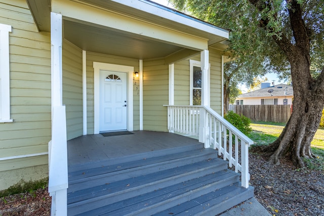 view of exterior entry featuring a porch