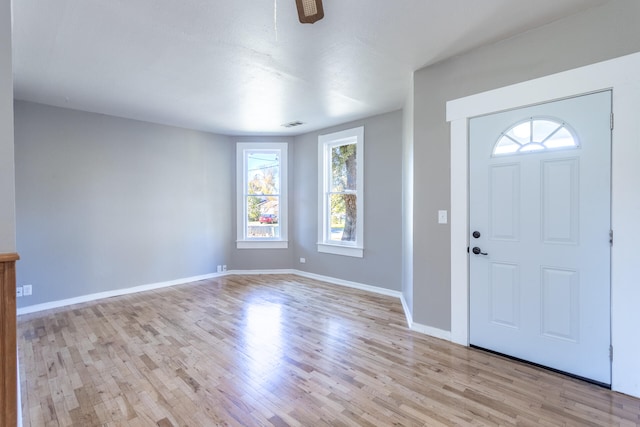 foyer entrance with light hardwood / wood-style floors