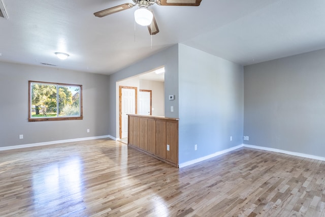 spare room with ceiling fan and light hardwood / wood-style flooring