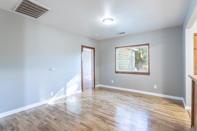 unfurnished room featuring light hardwood / wood-style flooring