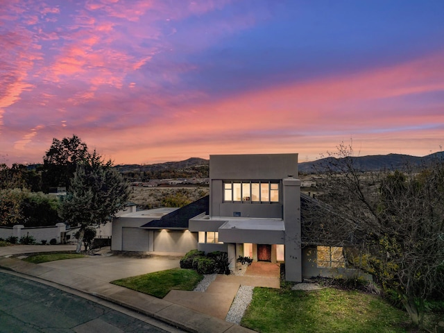 contemporary home featuring a mountain view and a garage