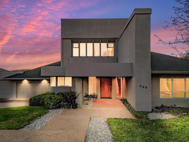 738 Sunriver Ln, Redding, CA 96001 - contemporary home with an attached garage, stucco siding, and a shingled roof