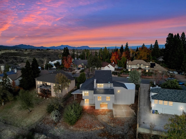 aerial view at dusk with a mountain view