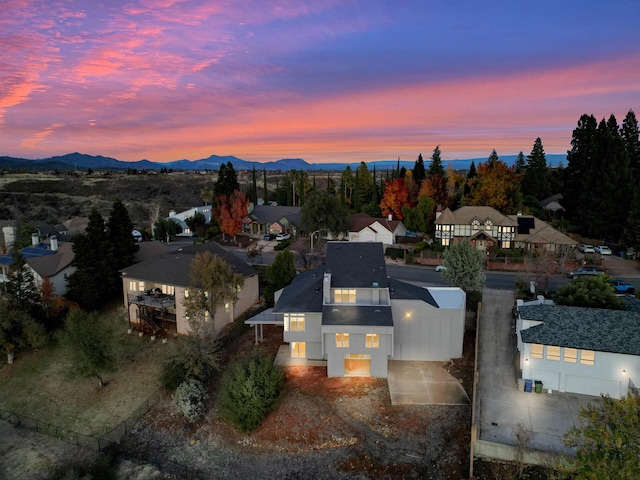 738 Sunriver Ln, Redding, CA 96001 - aerial view of property's location featuring a mountain backdrop and nearby suburban area