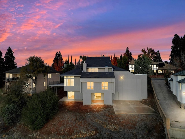 738 Sunriver Ln, Redding, CA 96001 - view of front of house with a balcony and stucco siding
