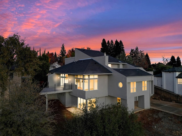 738 Sunriver Ln, Redding, CA 96001 - back of house with stucco siding and a shingled roof