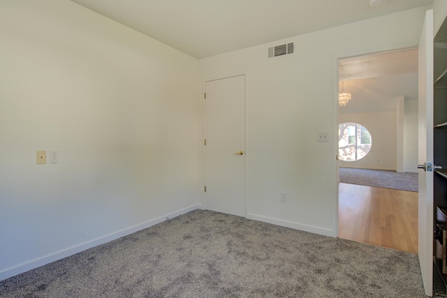 unfurnished room featuring hardwood / wood-style floors