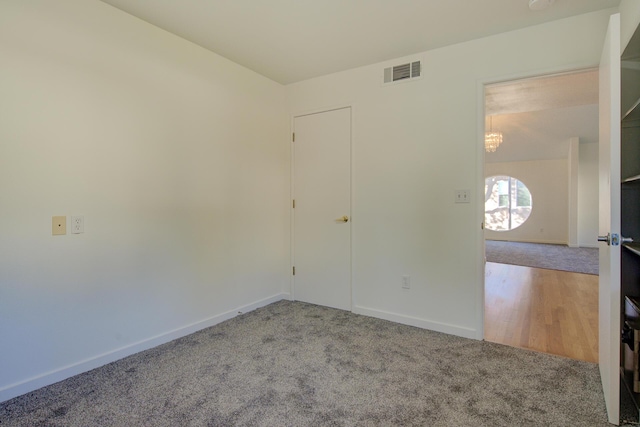 738 Sunriver Ln, Redding, CA 96001 - spare room with carpet flooring and a chandelier