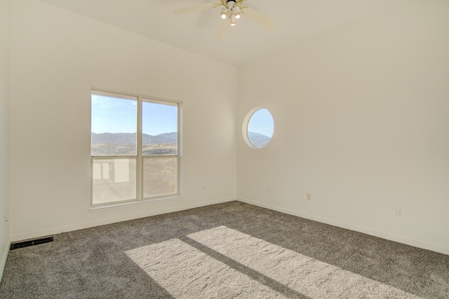 738 Sunriver Ln, Redding, CA 96001 - empty room with carpet floors, a ceiling fan, and a mountain view
