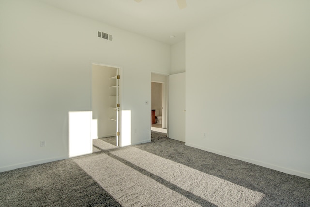 unfurnished room with carpet floors and ceiling fan