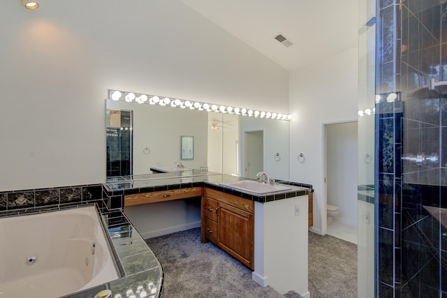 full bathroom with plus walk in shower, vanity, high vaulted ceiling, and toilet