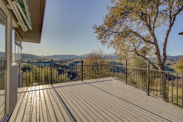 wooden terrace featuring a mountain view