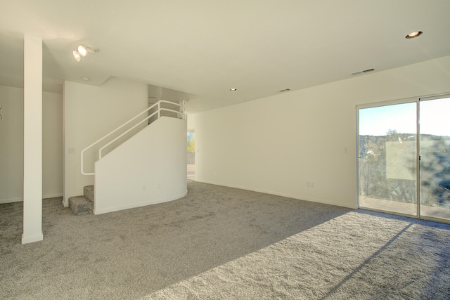 unfurnished living room featuring carpet flooring