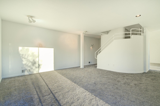 unfurnished living room with carpet flooring