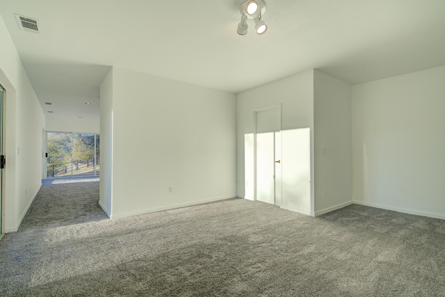 unfurnished room featuring carpet