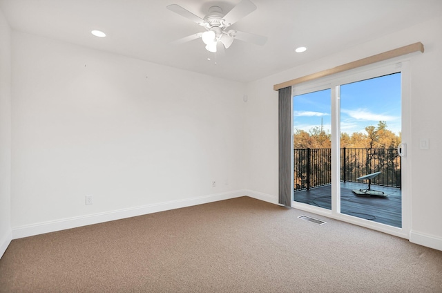 carpeted empty room with ceiling fan