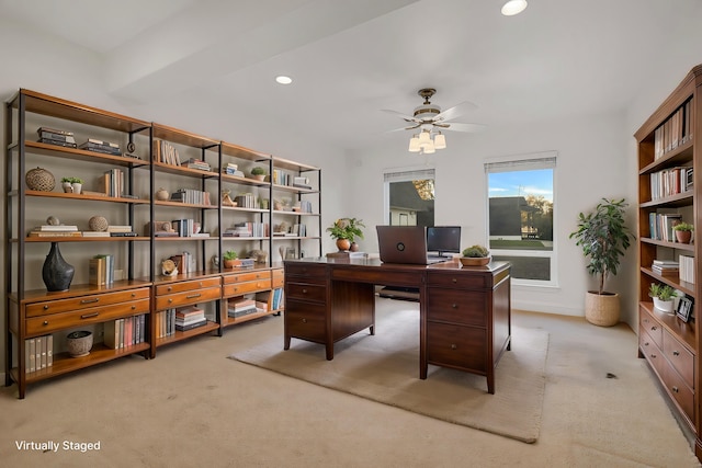 office featuring ceiling fan and light carpet