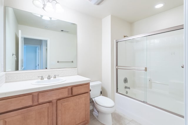 full bathroom featuring vanity, an inviting chandelier, tile patterned floors, toilet, and enclosed tub / shower combo