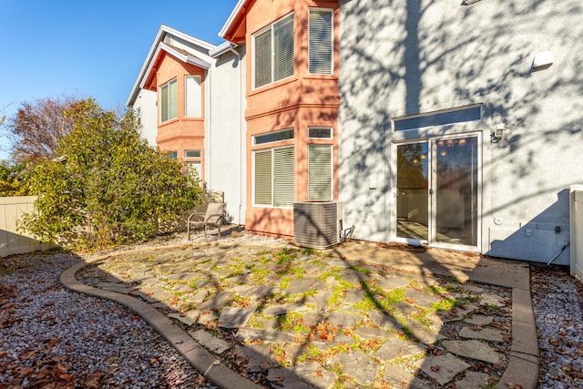 exterior space featuring central AC unit and a patio